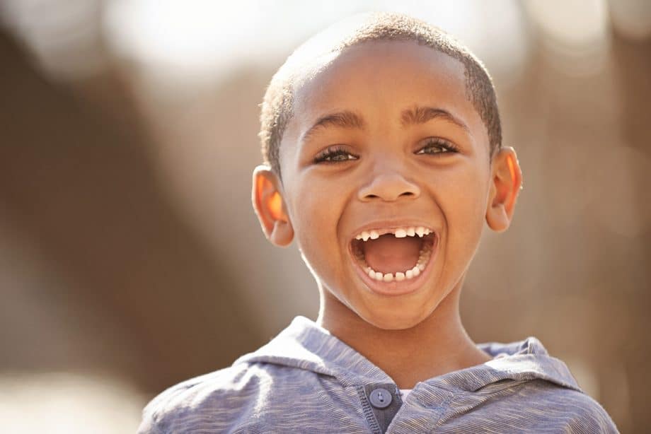 child with missing teeth