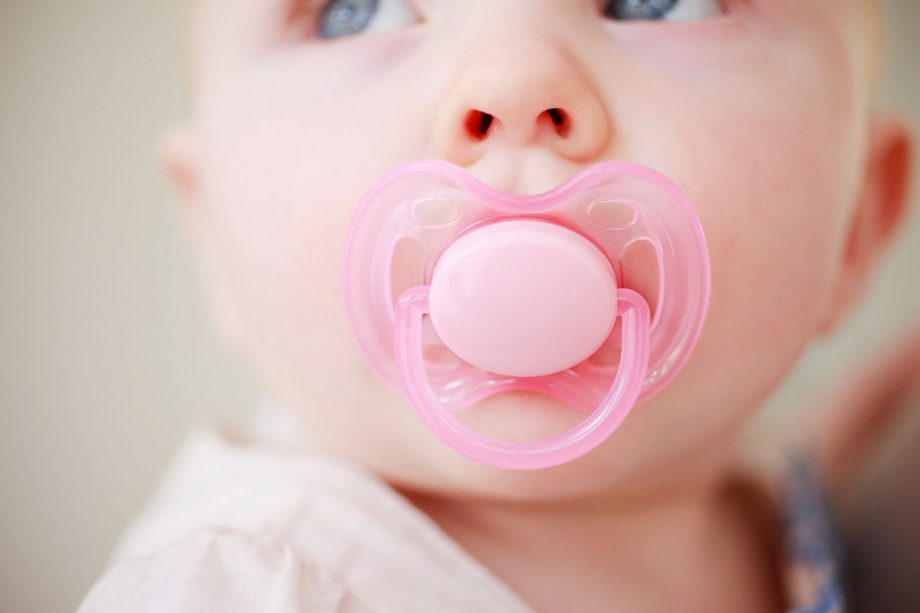 infant with pacifier